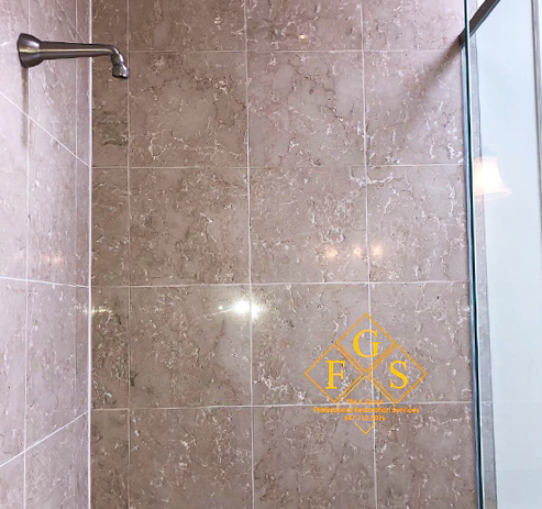 Porous Stone Tile Shower walls after sealing services by FGS tile and Grout that prevents excess water intrusion, preserves materials longer and leave them shiny.