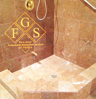 Salmon marble shower after intense natural stone restoration from staining, efflorescence, dullness and more by FGS Tile and Grout Natural Stone Maintenance Service.