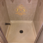 picture showing Ronal and FGS regrouted the entire shower, replaced the caulking, replaced cracked tiles and cleaned the shower pan so that the whole shower looked liked it had been replaced. They went the extra mile when they discovered a rotted entrance ledge and replaced it.