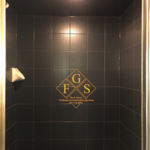 black tiled shower walls after professional cleaning shower services by FGS Tile and Grout