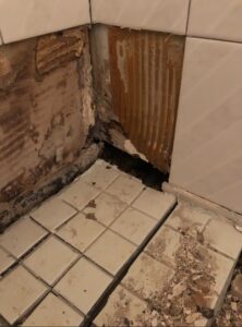 before FGS tile and grout shower restoration picture showing shower structural damage due to mold and mildew.